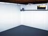 The BrightWall system is a bright white washable panel that can be installed on damp or leaking basement walls